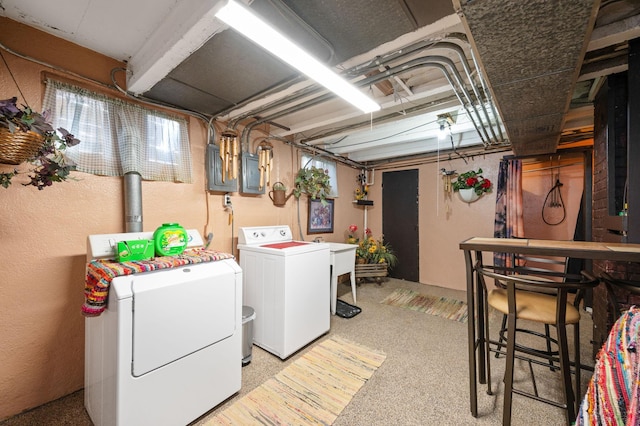 laundry area with washing machine and clothes dryer