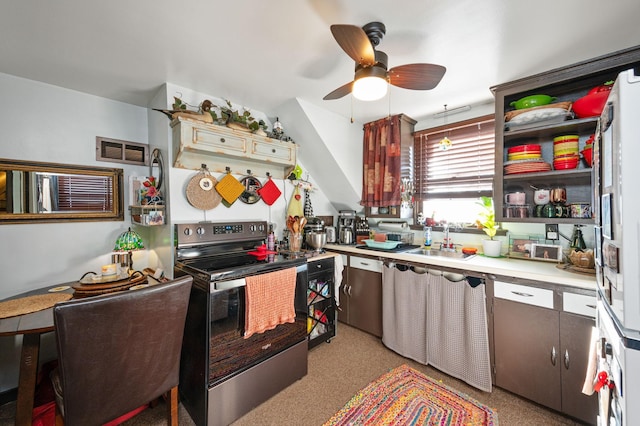 kitchen featuring ceiling fan, sink, and stainless steel range with electric stovetop