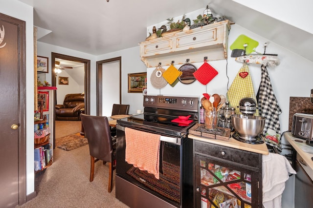 kitchen with light colored carpet, stainless steel electric stove, and ceiling fan