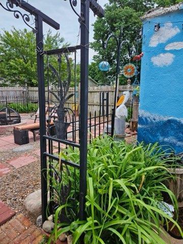 view of gate with a fire pit