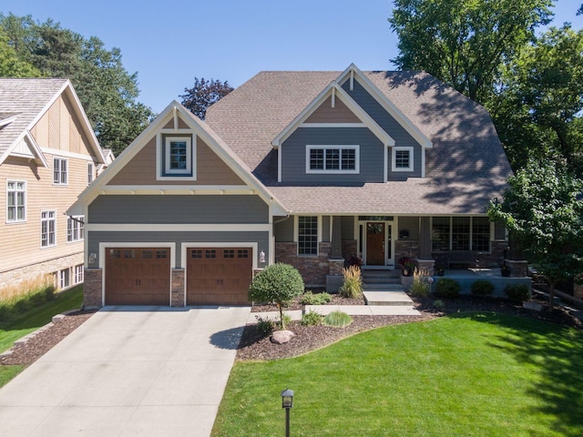 craftsman-style house with a garage, a front yard, and covered porch