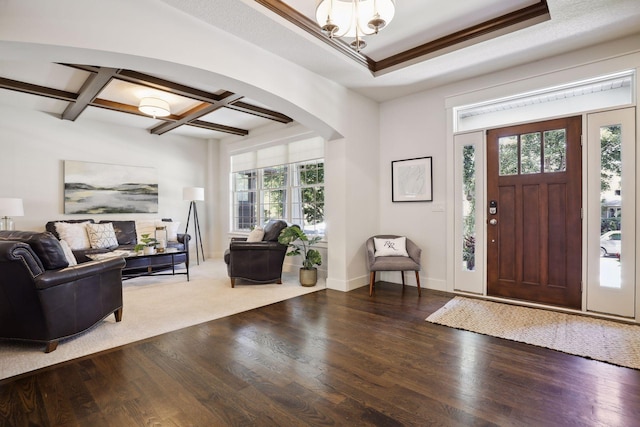 entrance foyer with wood-type flooring, coffered ceiling, and beam ceiling