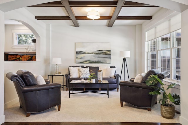 living area with coffered ceiling, carpet floors, and beamed ceiling