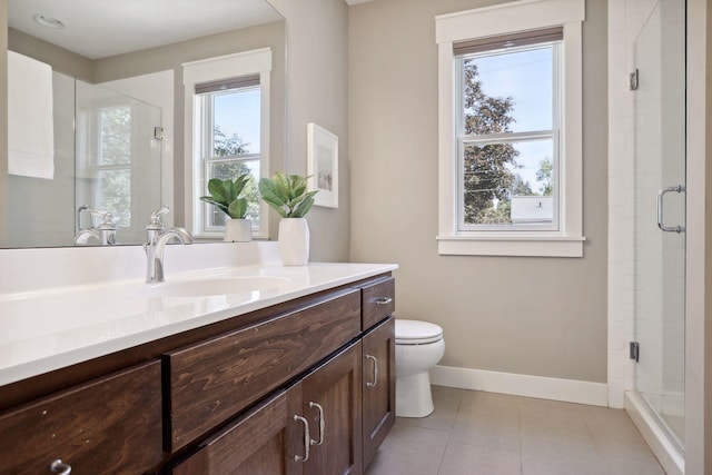 bathroom featuring vanity, toilet, tile patterned flooring, and a shower with door