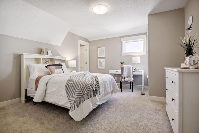 carpeted bedroom with a textured ceiling