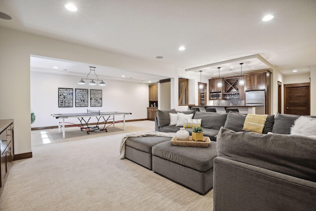 living room featuring light carpet