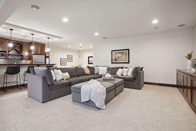 carpeted living room with bar area