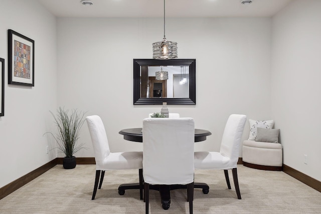 dining area featuring carpet