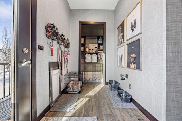 hallway with dark hardwood / wood-style flooring