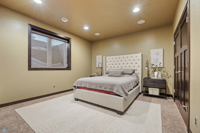 bedroom with light carpet