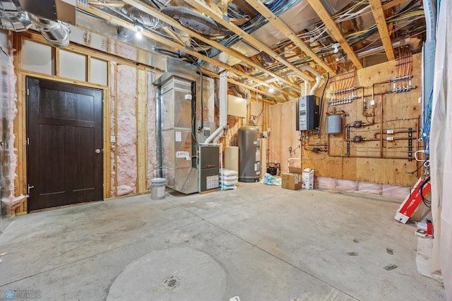 basement featuring gas water heater, heating unit, and water heater