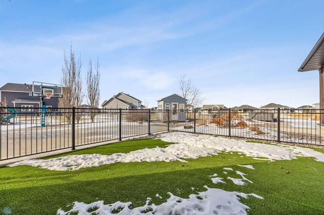 view of yard featuring basketball court