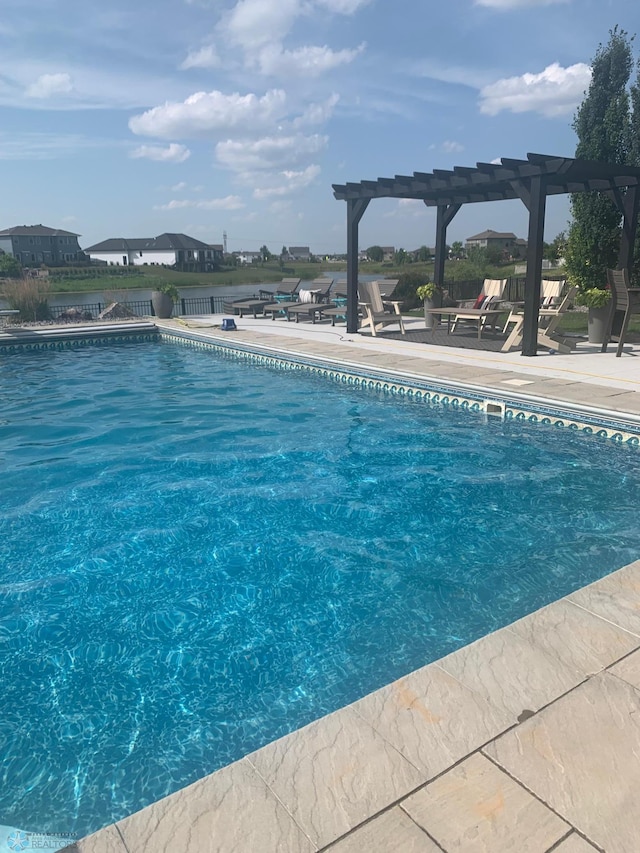 view of swimming pool with a pergola and a patio area