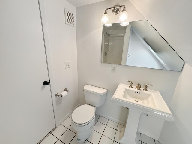 bathroom featuring sink, tile patterned floors, and toilet