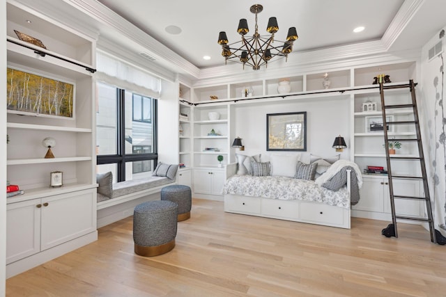 bedroom with an inviting chandelier, ornamental molding, and light wood-type flooring