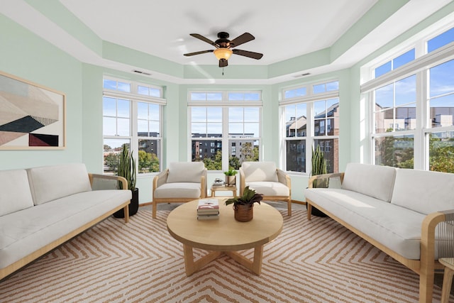 sunroom / solarium featuring ceiling fan