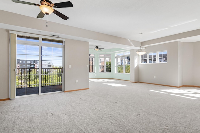 unfurnished living room featuring carpet flooring and ceiling fan