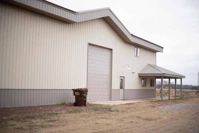 view of side of property with a garage