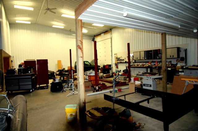 garage featuring a workshop area and ceiling fan