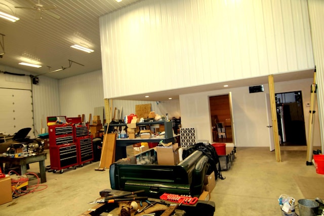 garage featuring a workshop area and ceiling fan