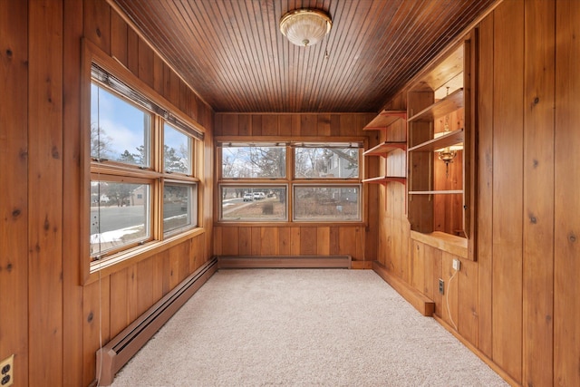 unfurnished sunroom with wooden ceiling and baseboard heating