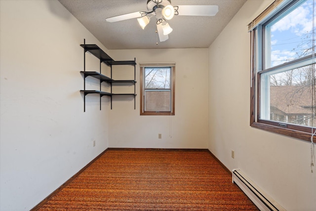 unfurnished room featuring a baseboard radiator, carpet flooring, and a textured ceiling