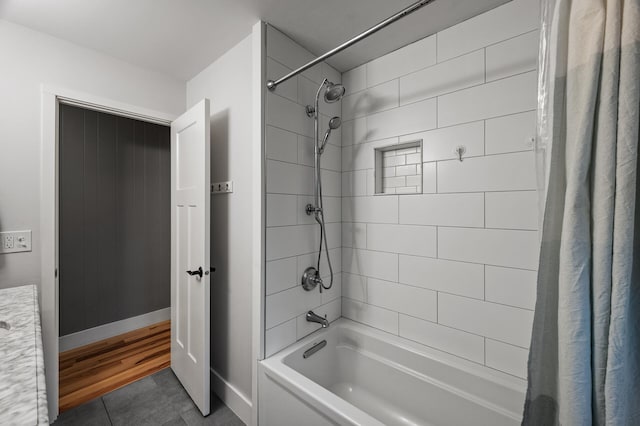 full bathroom featuring shower / tub combo with curtain, baseboards, and tile patterned floors