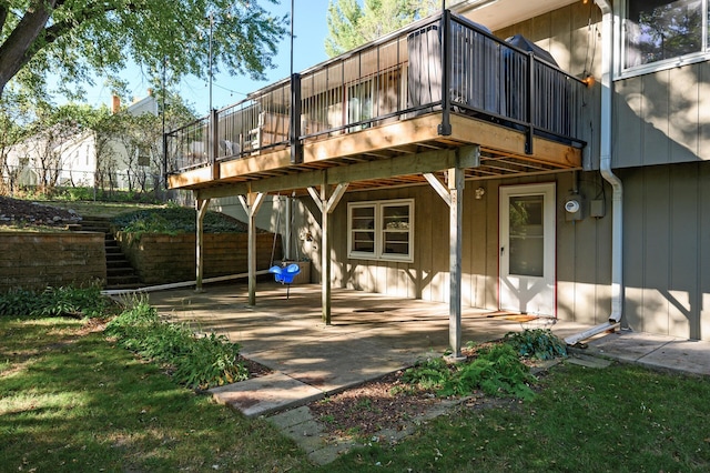 back of house with a patio area, stairway, and a deck