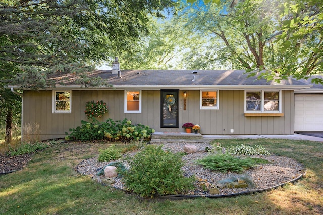 single story home featuring a garage