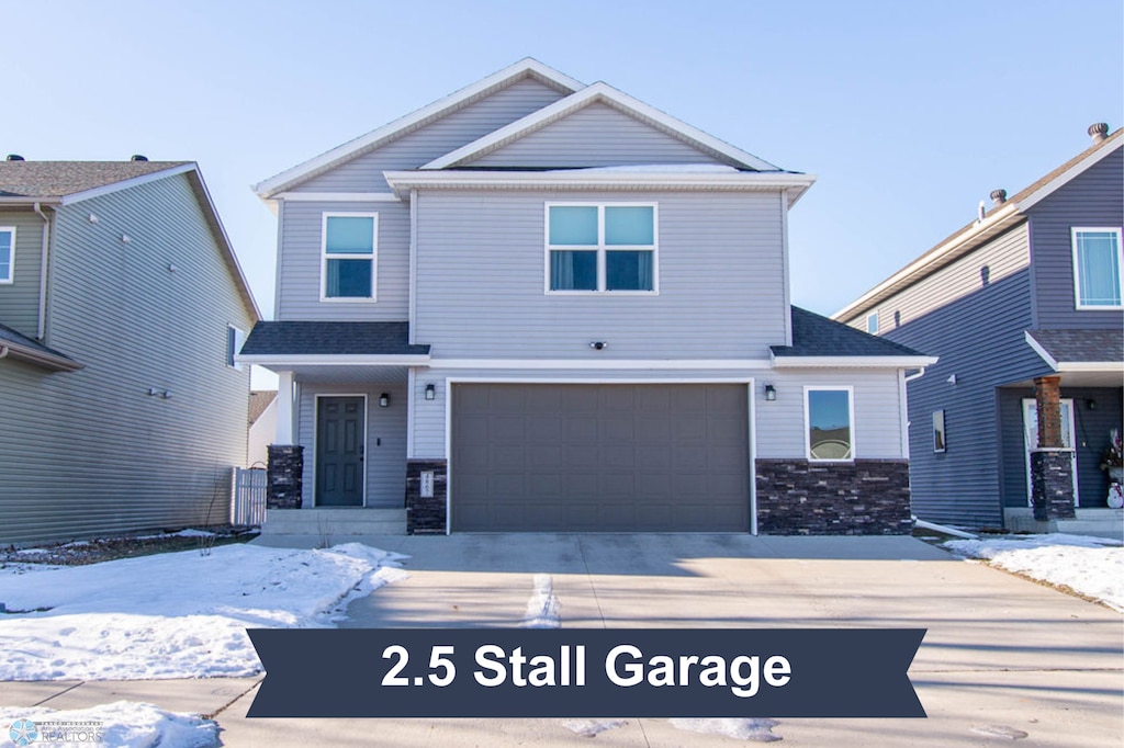 view of front of property with a garage