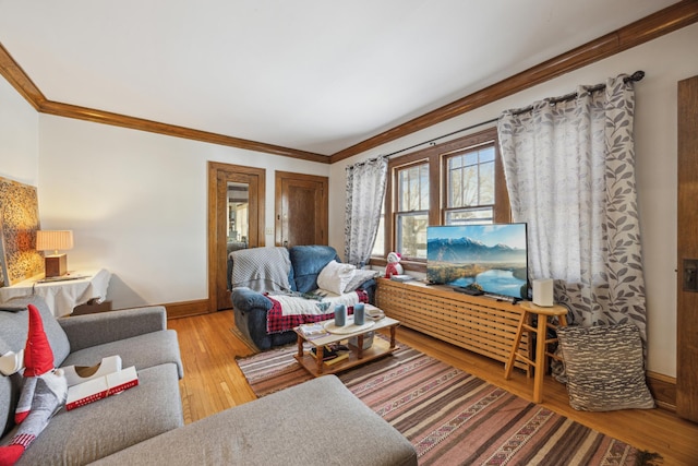 living room with hardwood / wood-style flooring and crown molding