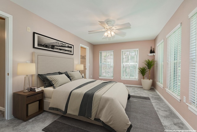 bedroom featuring light carpet and ceiling fan