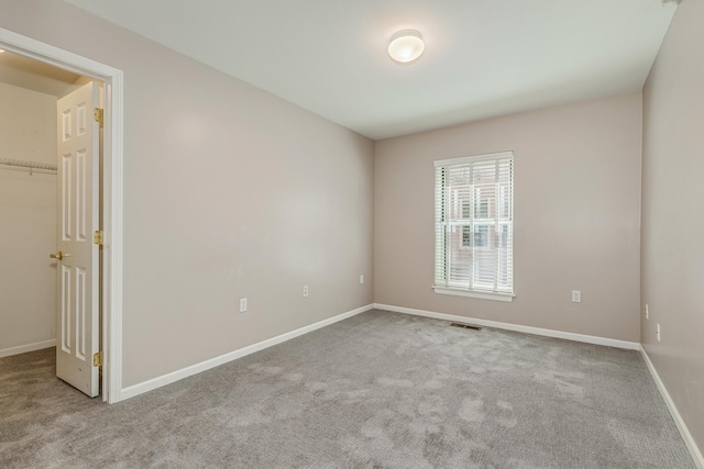 empty room featuring light carpet