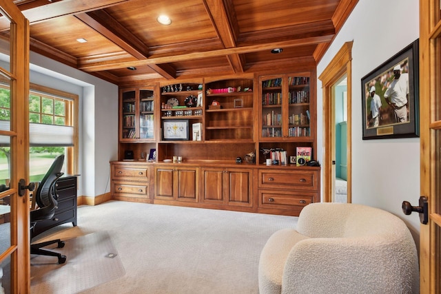 office space with carpet, coffered ceiling, wood ceiling, crown molding, and beam ceiling