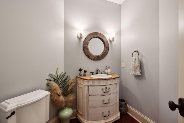 bathroom with vanity and toilet