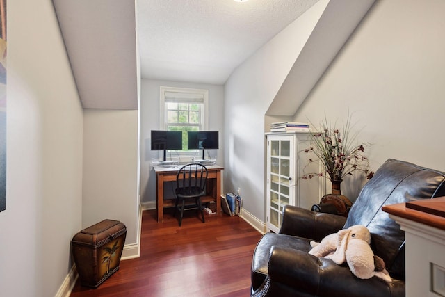 home office featuring dark hardwood / wood-style flooring and a textured ceiling