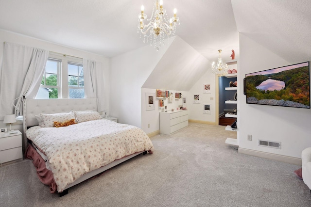 bedroom with a chandelier, light colored carpet, and vaulted ceiling