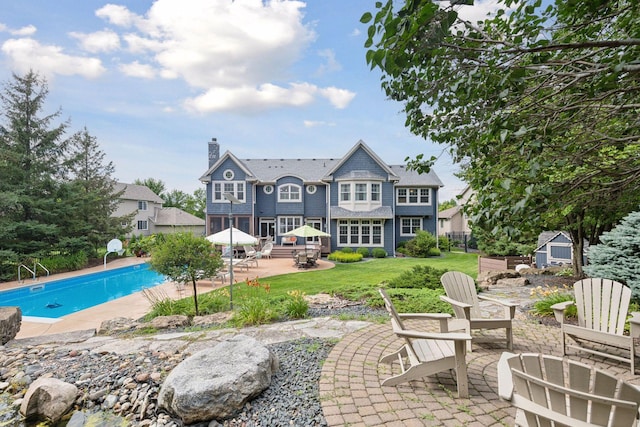 back of house with a patio area