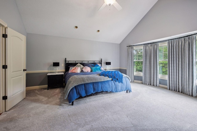 bedroom featuring ceiling fan, carpet, and high vaulted ceiling