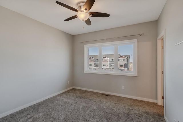 unfurnished room with carpet floors and ceiling fan