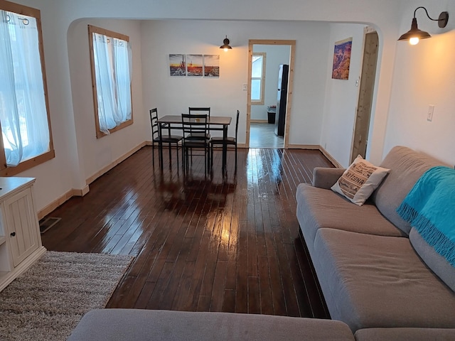 living room with dark wood-type flooring