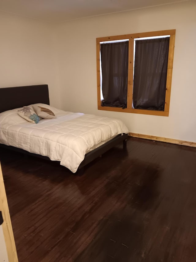 unfurnished bedroom with hardwood / wood-style floors