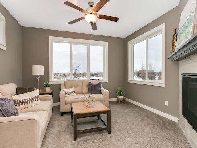 living room featuring carpet floors and ceiling fan