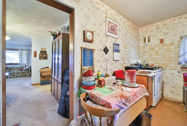 view of carpeted dining area