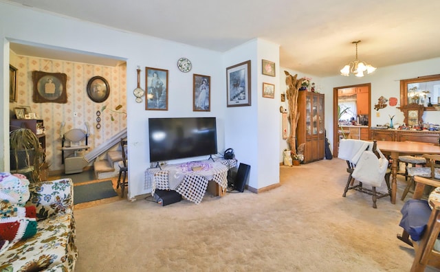 carpeted living room featuring a notable chandelier