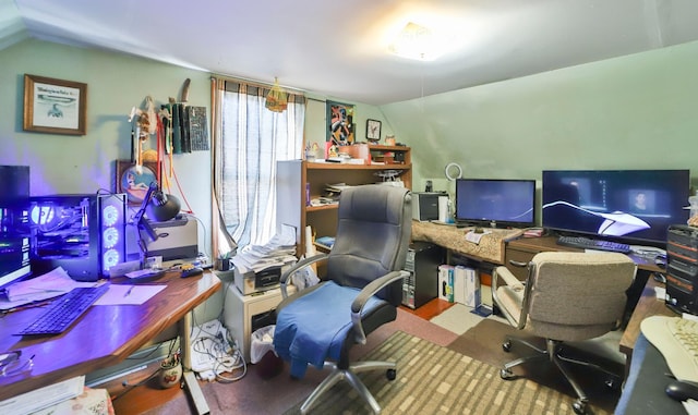 home office with lofted ceiling