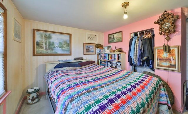 bedroom with carpet flooring and a closet