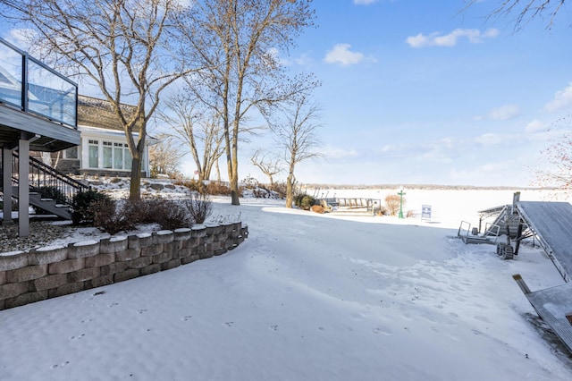 view of yard covered in snow