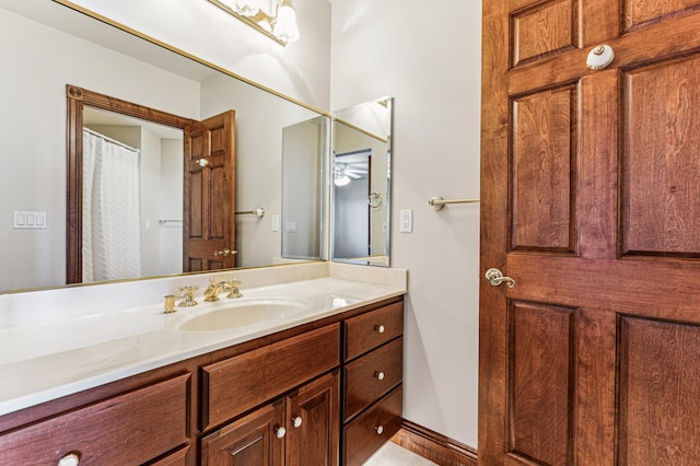 bathroom with vanity and baseboards