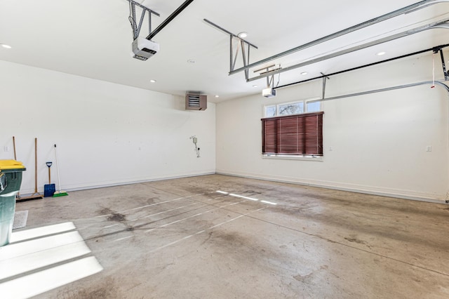 garage with baseboards and a garage door opener